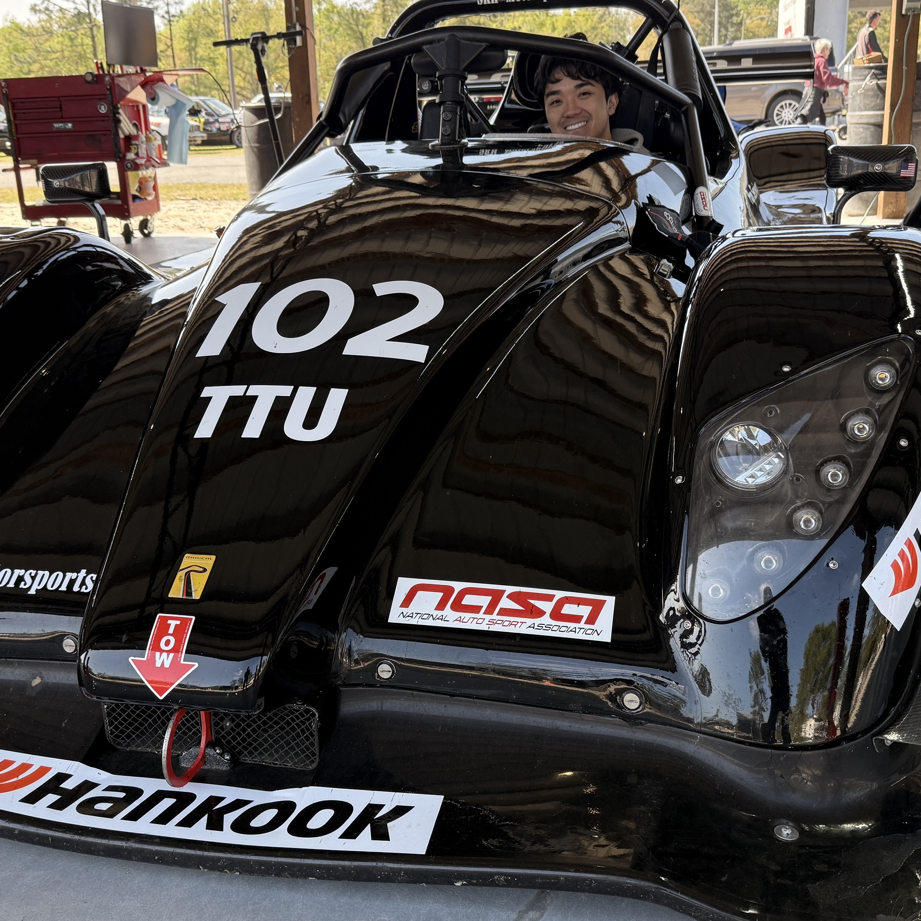 Ridge in a Radical race car at the track